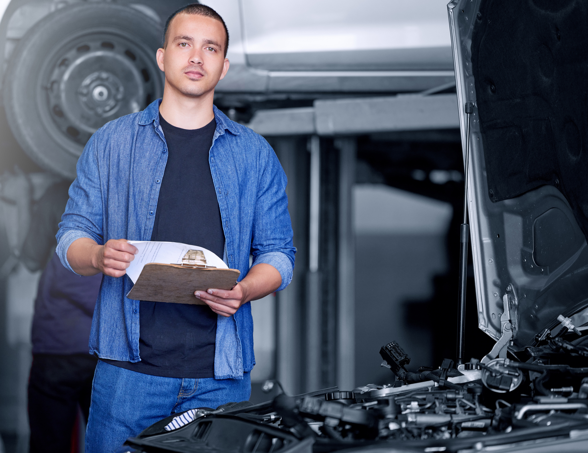Engineer, mechanic and car engine manager with checklist working on performance quote. Portrait of man motor technician, repair service and maintenance or diesel vehicle machine oil inspection.